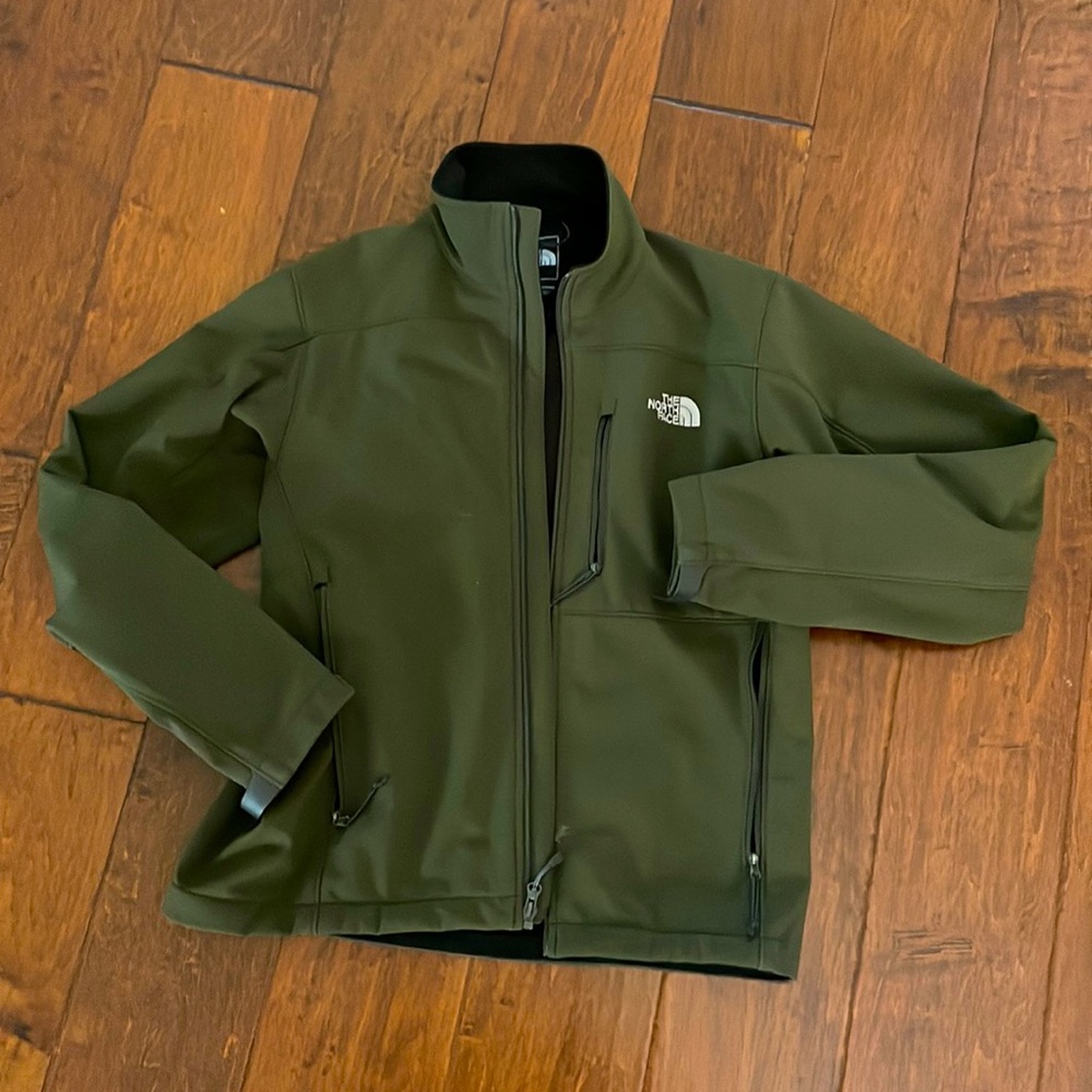 The North Face jacket in mint condition, no tear.